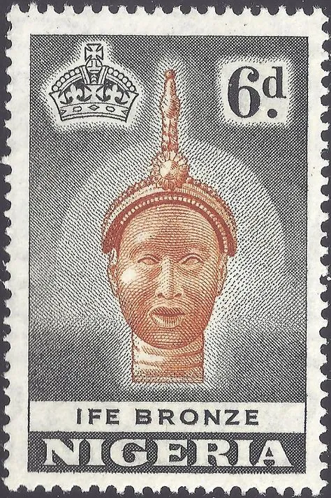 A Nigerian 6d postage stamp showing an Ife bronze head in orange-brown on grey and black, with a crown at the top left.